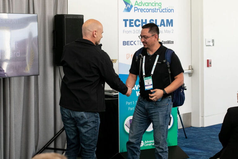 Conference attendees networking during a construction technology event