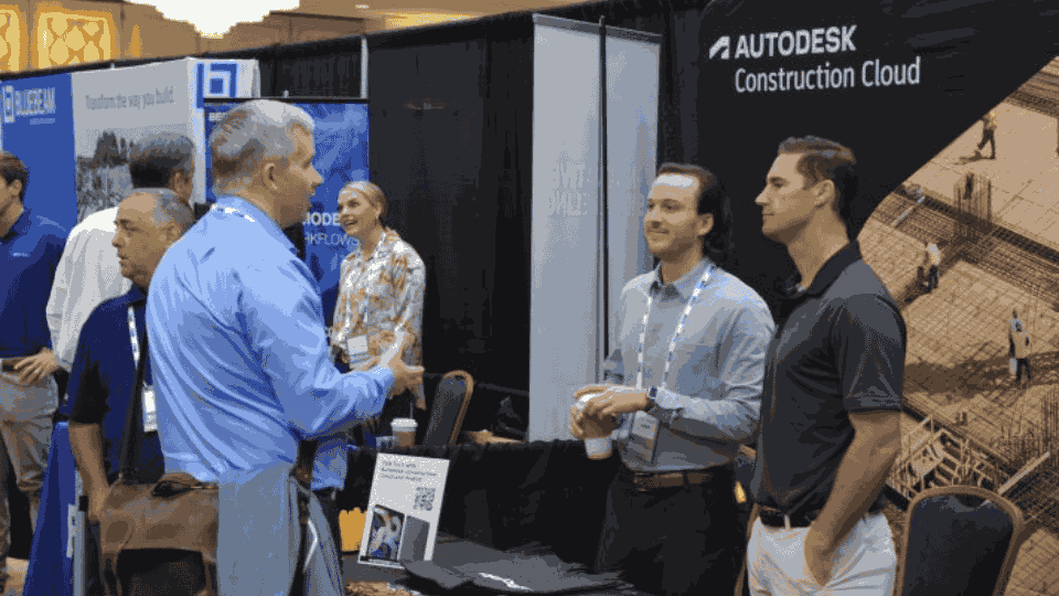 Attendees networking with exhibitors on mass timber project delivery solutions