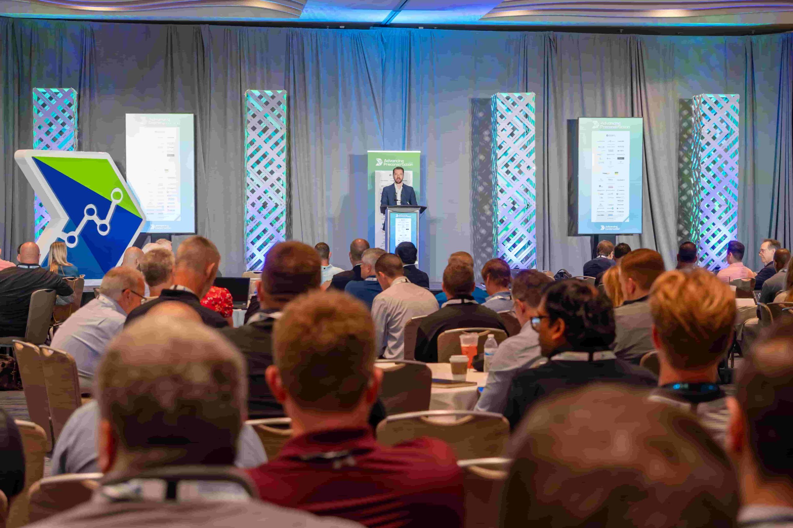 Conference attendees engaging in project delivery and construction innovation discussions